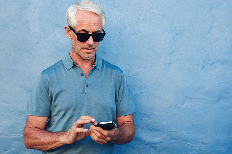 Man with phone with hearing loss